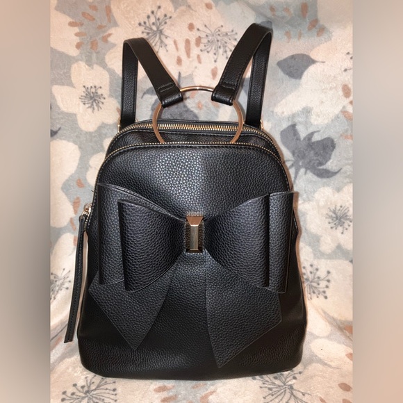 Crossi Handbags - Crossi Bow Backpack EUC